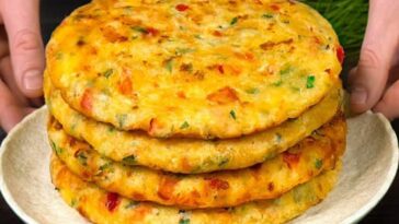 Savory pancakes with cheese, vegetables and yogurt sauce