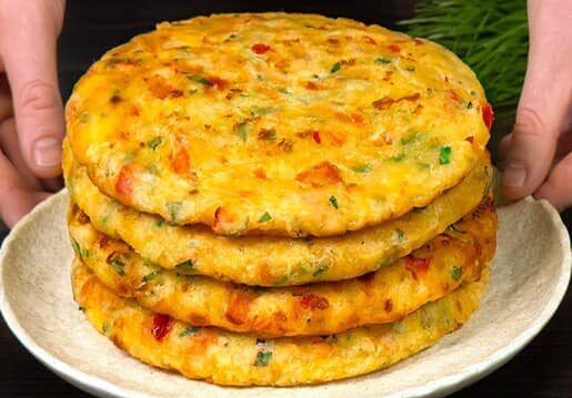 Savory pancakes with cheese, vegetables and yogurt sauce